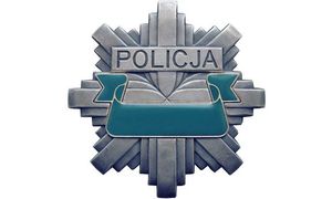 odznaka z napisem policja